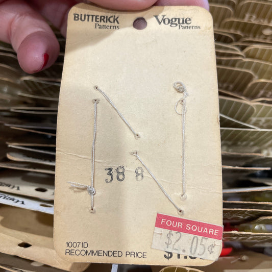 Card held by a hand with red nail polish.