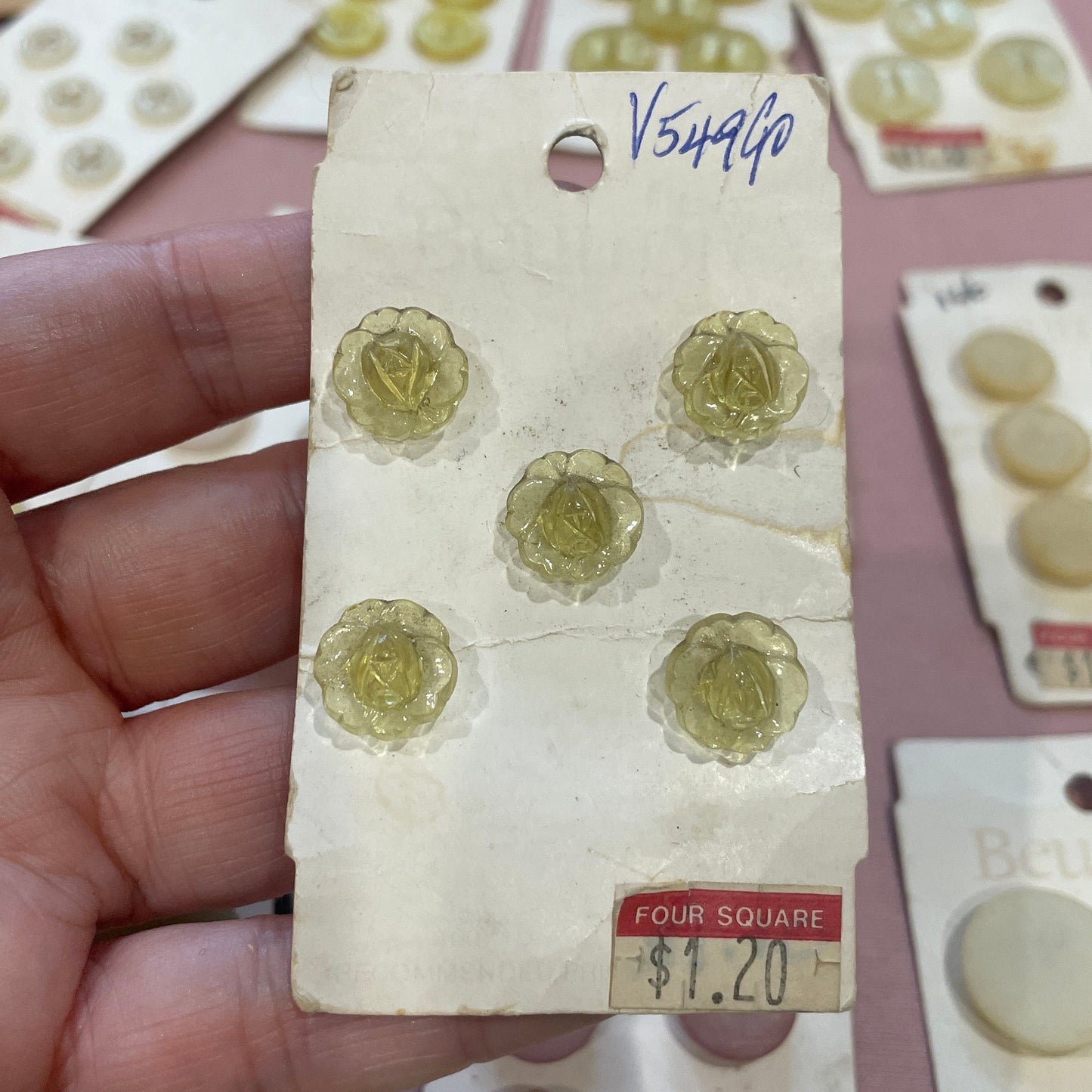 Hand holding a button card