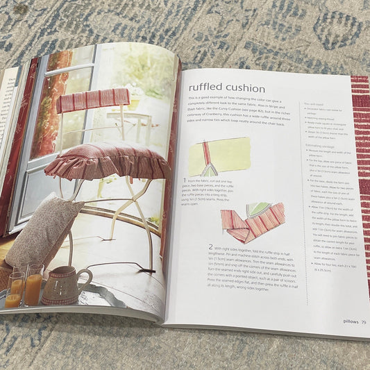 Open book on a textured surface with visible text and images.