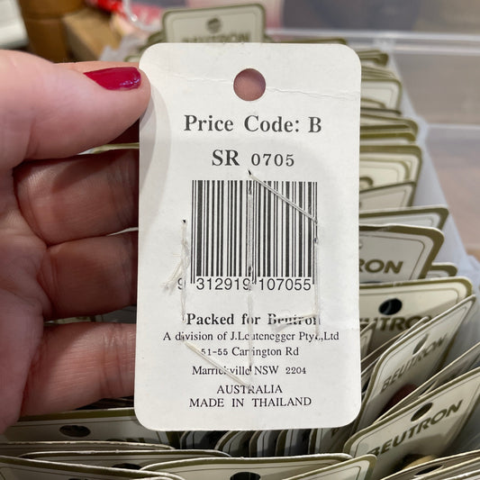 Close-up of a price tag on a product with visible branding and text.