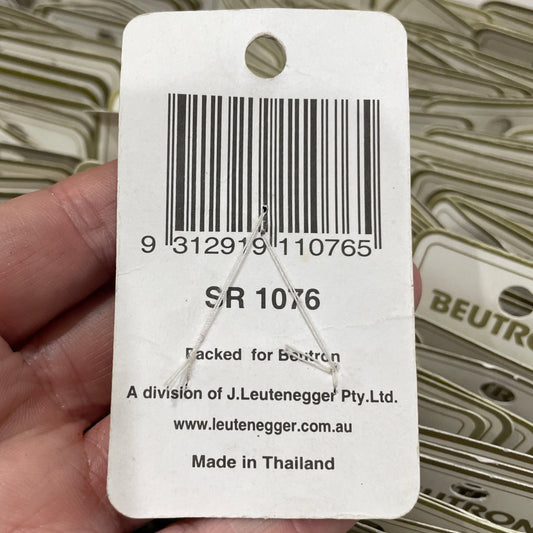 Barcode label held by a hand with a blurred background
