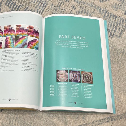 Open book on a textured surface with visible text and images.