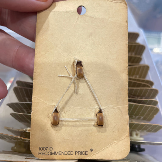 Hand holding a card against a blurred background