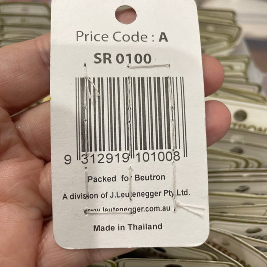 Barcode label held by a hand with blurred background