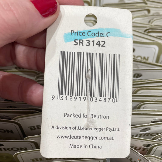Hand holding a Leuvenron product tag with a barcode and text.