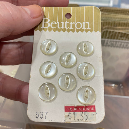 Card with buttons held by a hand, with a blurred background