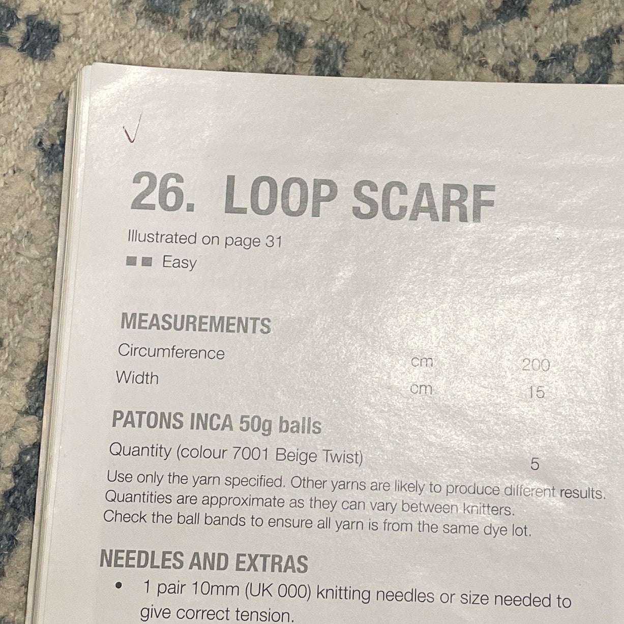 Book with a scarf pattern on a textured surface
