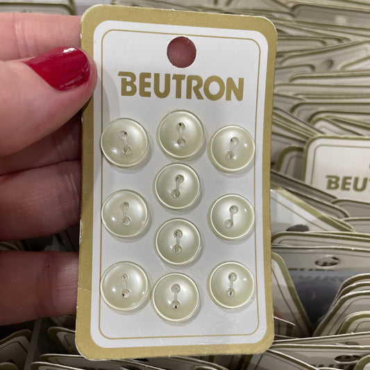Card with buttons and 'Beutron' branding held by a hand.