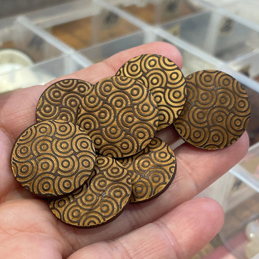 Hand holding buttons with a blurred background