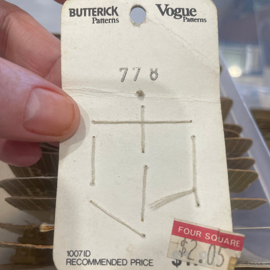 Card held by a hand with a blurred background